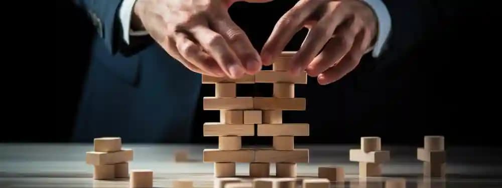 Manager arranging dominoes to represent planned marketing execution