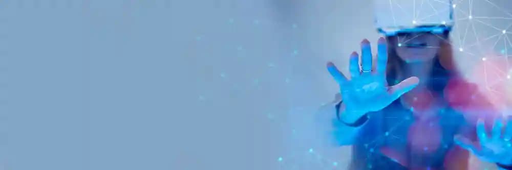 Woman wearing VR headset representing immersive design and technology solutions